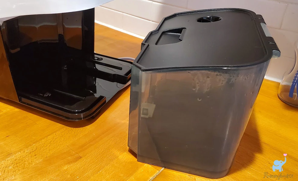 emptying waste water bin on the baby brezza bottle washer pro