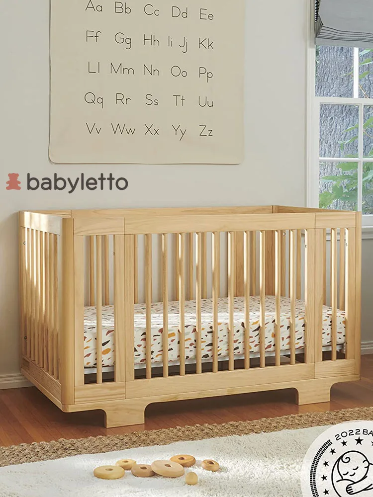 a wooden babyletto yuzu crib