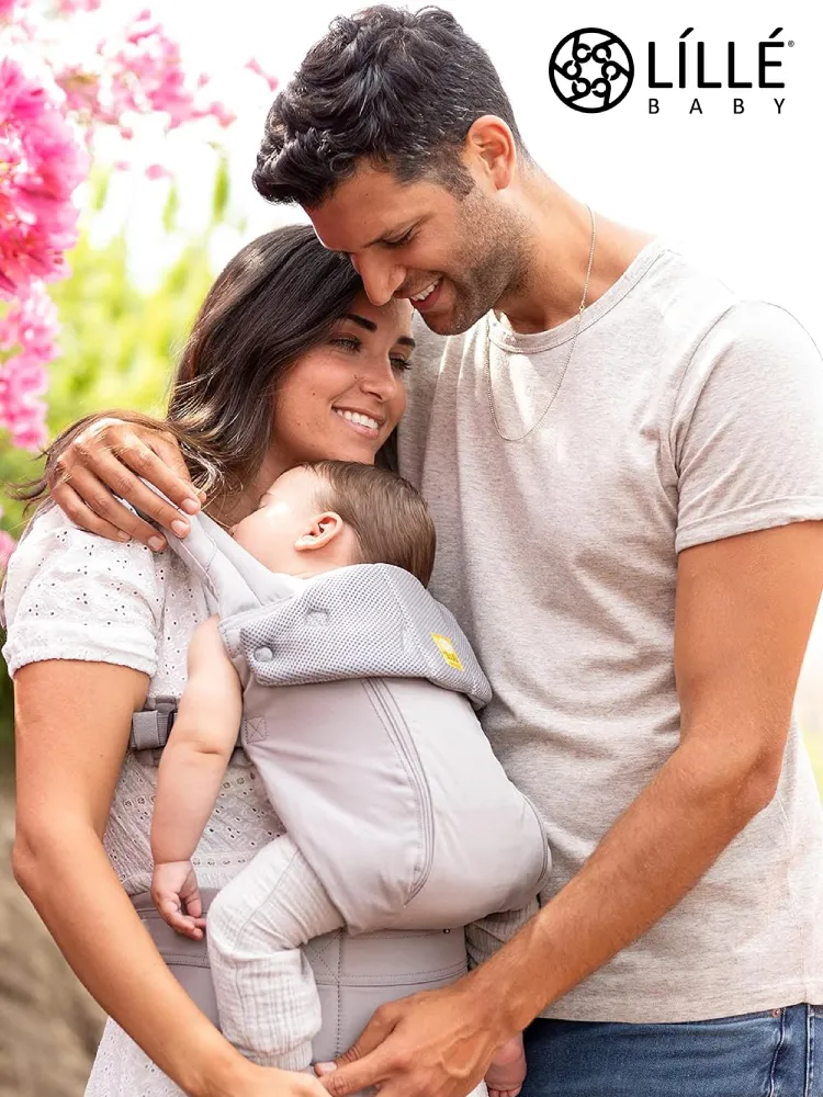 a woman carrying a baby in a lillebaby complete all season baby carrier along with multiple color and pattern options