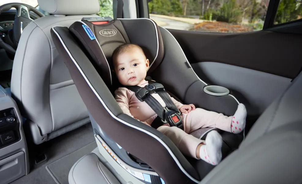 preschooler sitting in a safety 1st convertible car seat