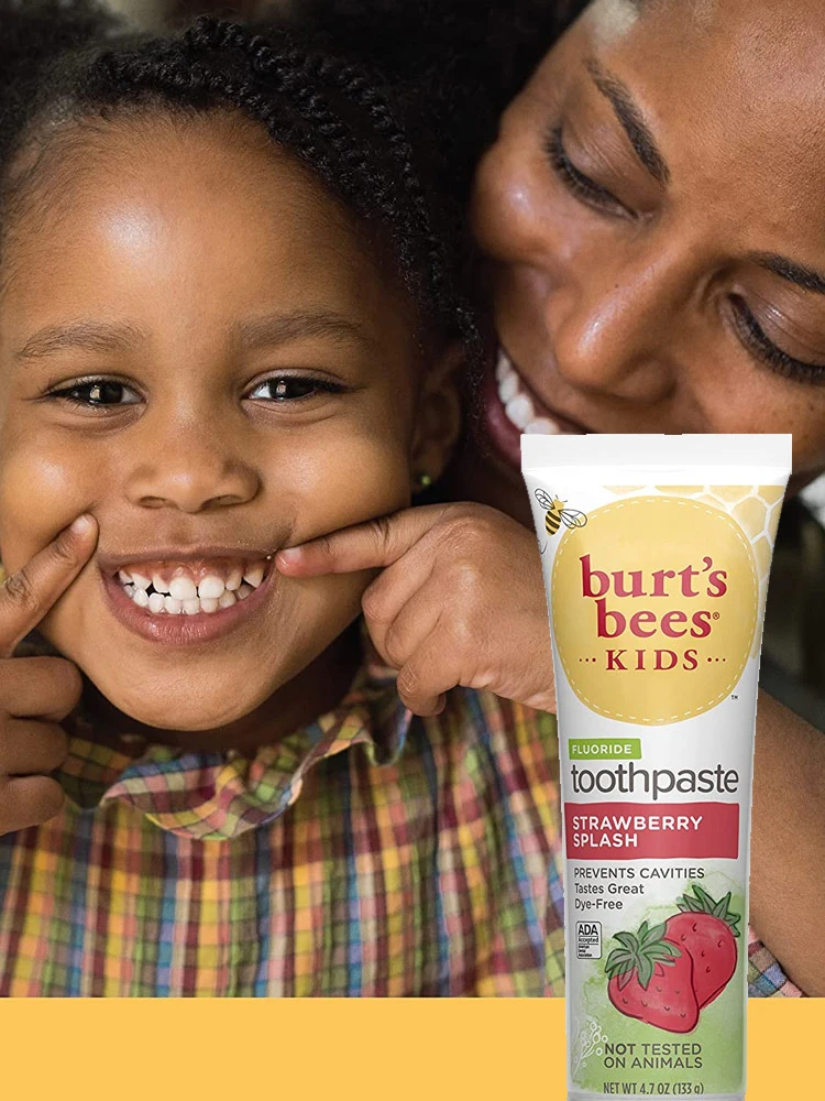Burt's Bees Fluoride Kids Toothpaste tube and smiling toddler