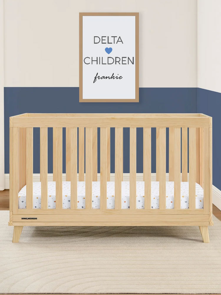 the delta children frankie crib in a colorful nursery