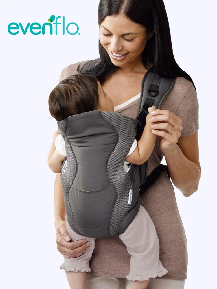 a mother carrying a baby in an Evenflo Soft Infant Carrier