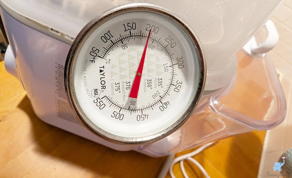 testing the temperature of the grownsy easeclean bottle washer pro