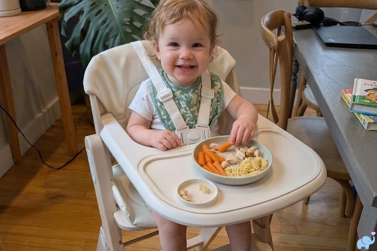 review of the mamazing growpod with a baby sitting in the high chair eating food