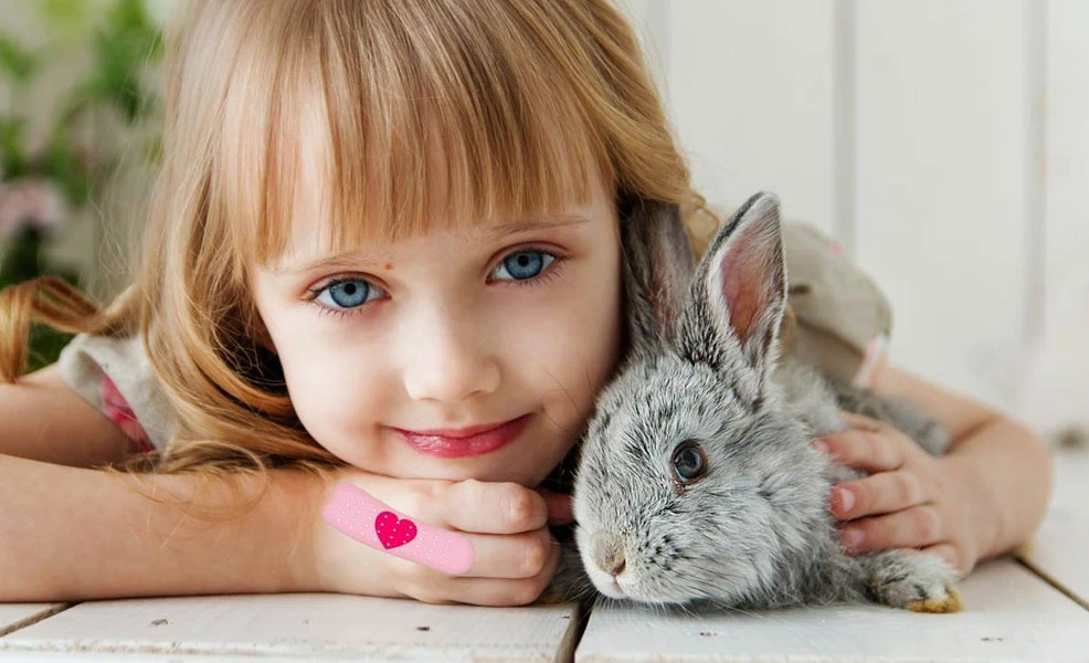 a girl with cut on her hand covered with kids bandage