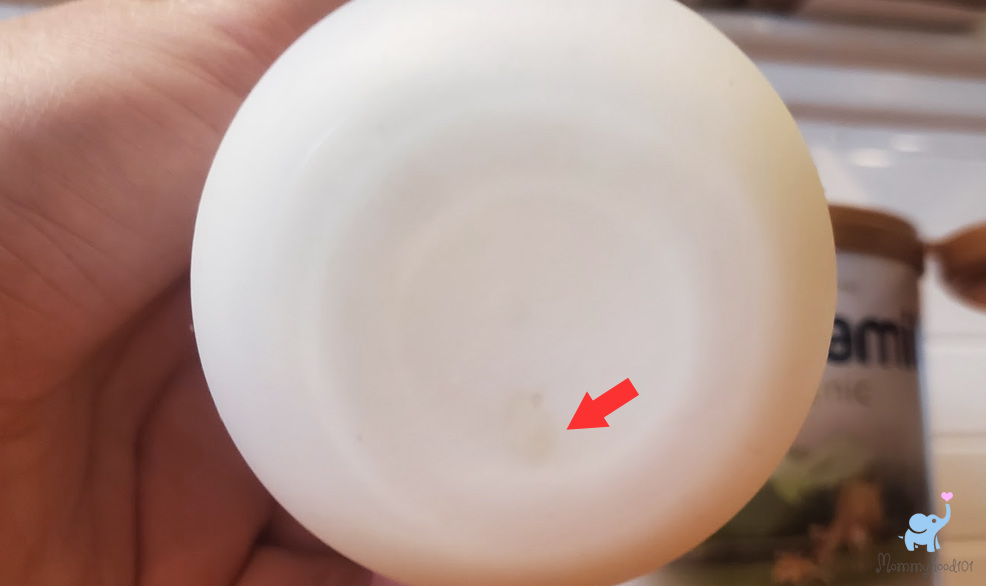 prepared bottle of kendamil organic formula clump at bottom