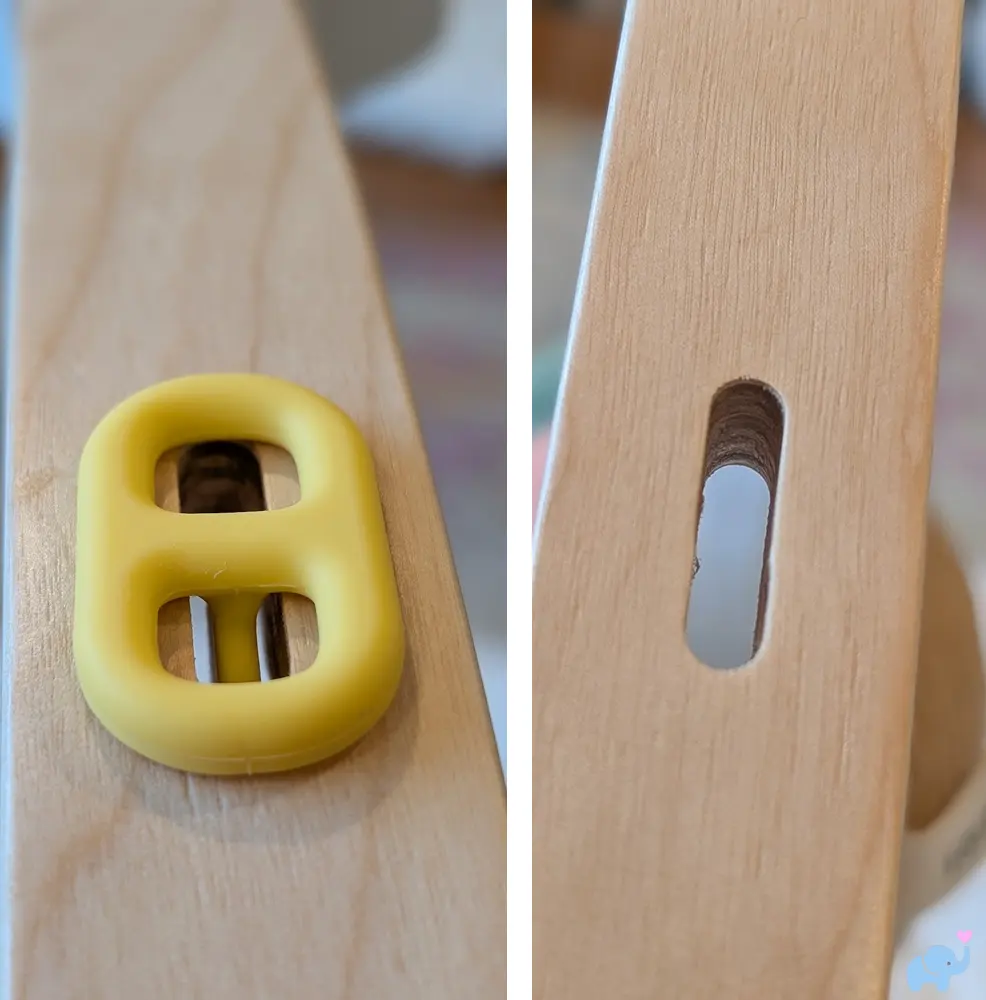 Adjustable hanging toy slots on the Lalo Play Gym II wooden arch