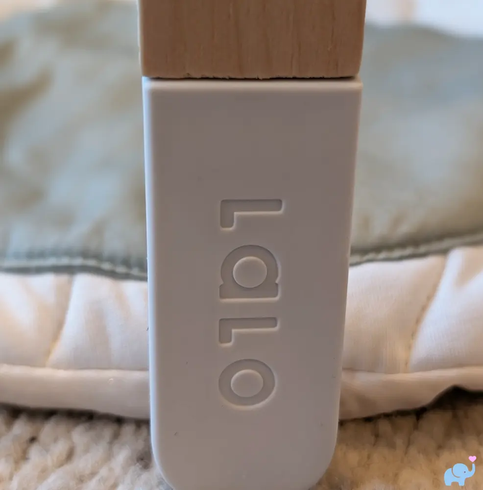 Lalo logo subtly branded on a wooden leg of the play gym