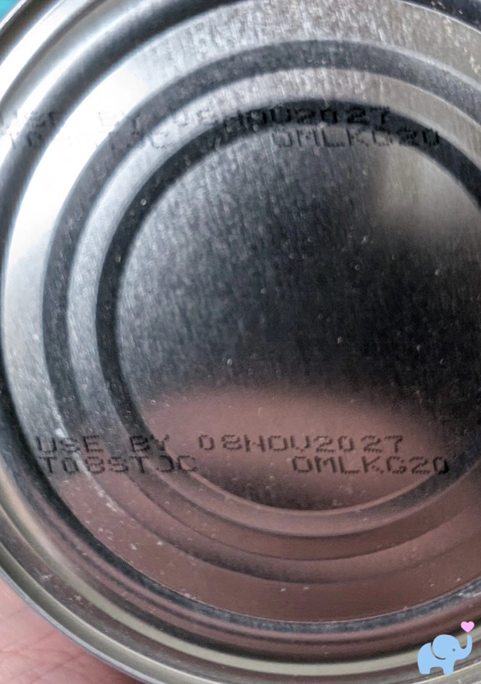 close-up of the bottom of a Little Spoon formula tin showing the expiration date