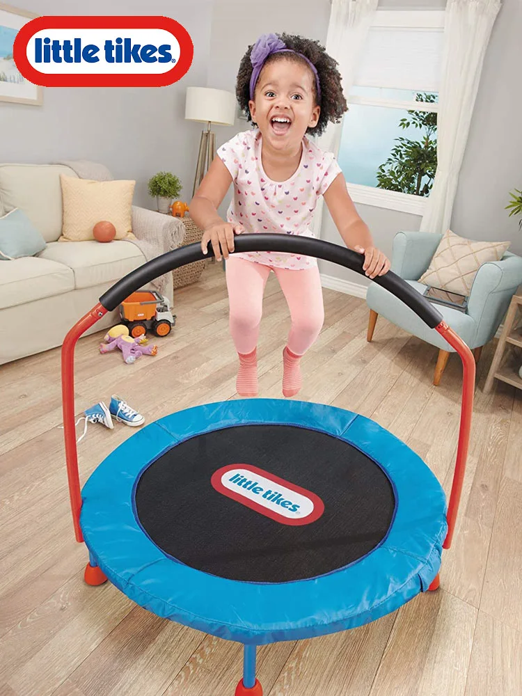 child jumping on the Little Tikes trampoline in the living room