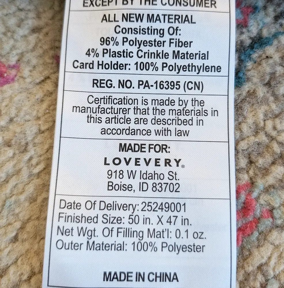 Lovevery Play Gym label showing material composition and finished size