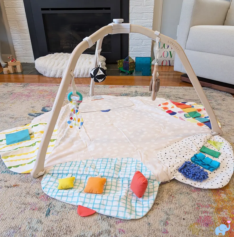 Lovevery Play Gym fully assembled in a living room