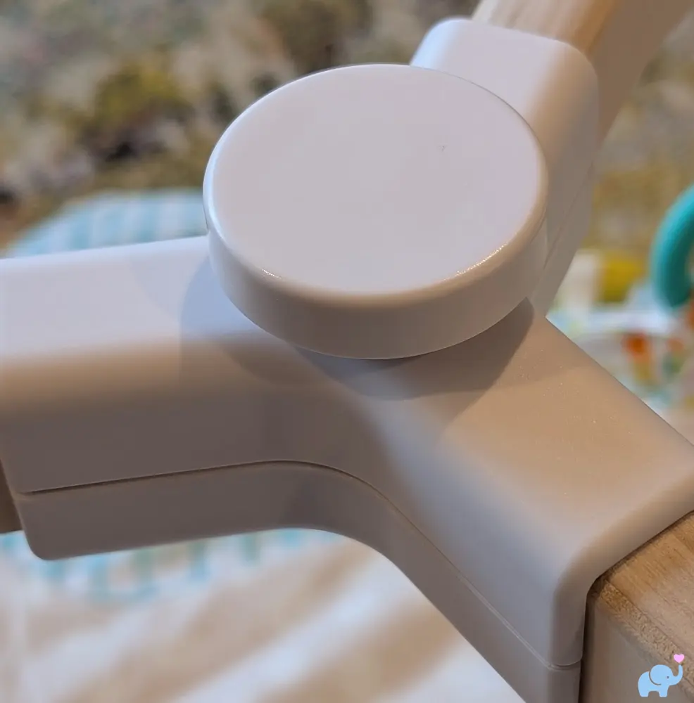 Lovevery Play Gym top bracket showing connection point for the three wooden arches