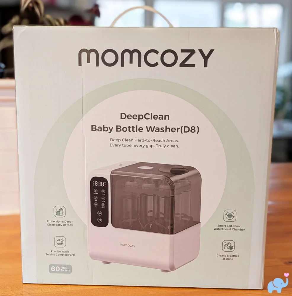Momcozy DeepClean Baby Bottle Washer D8 still in the box on a kitchen counter