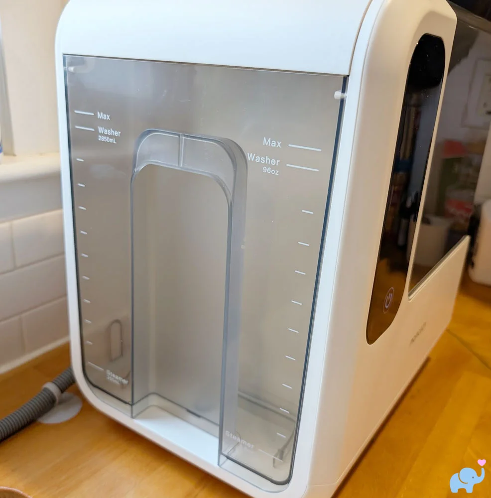 Removable water tank for the Momcozy DeepClean Baby Bottle Washer D8 showing fill lines