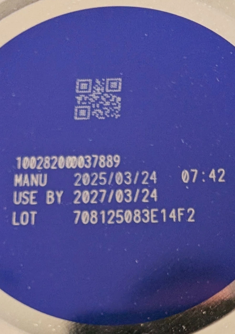 close-up of the bottom of a Nara Organics formula tin showing the expiration date
