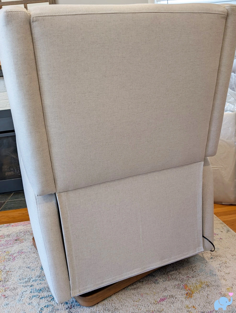 Back panel of Drift glider showing electronics cover and power cord