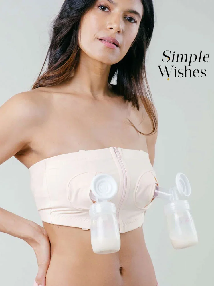 woman using simple wishes nursing bra for hands-free pumping