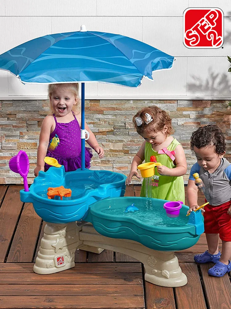 kids playing with the step2 seaway water table