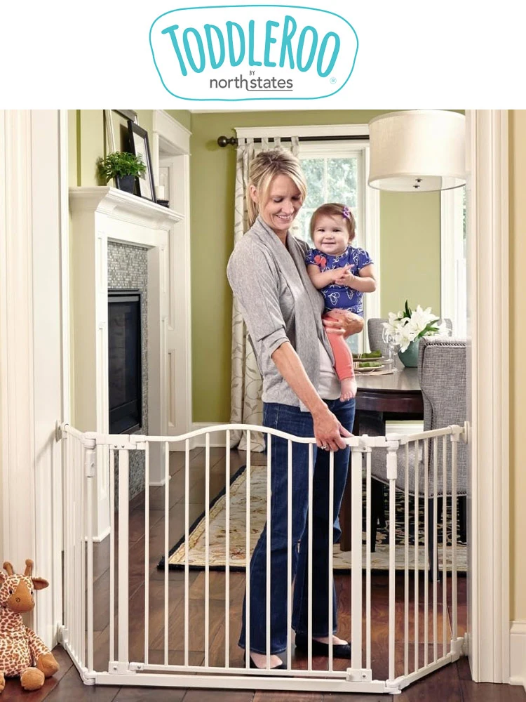 North States Toddleroo Baby Gate with mother carrying baby